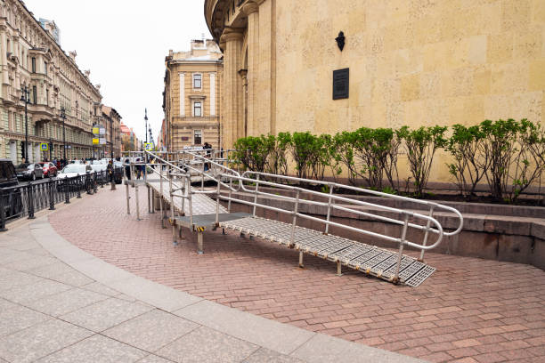 steel ramp for wheelchairs at subway entrance on street. metal ramp for people. - physical impairment wheelchair disabled accessibility imagens e fotografias de stock