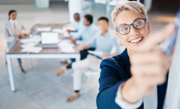 istock Presentation, training and planning with a female leader, manager or CEO in a workshop for learning and development. Coaching, teaching and growth with a mindset of the company vision and mission 1439935682