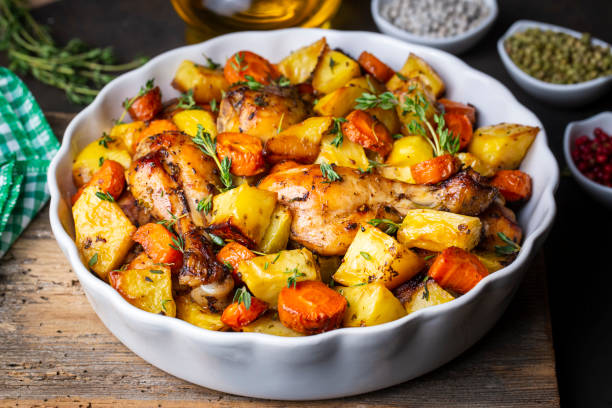 istock Baked chicken thighs and fried potatoes look delicious. 1439941550