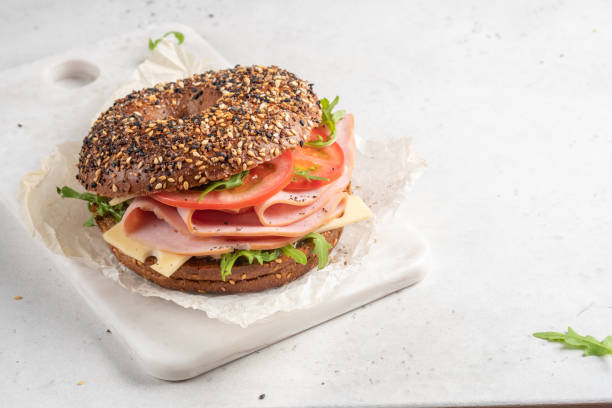 istock bagel filled with ham, cream cheese and tomato 1439946382