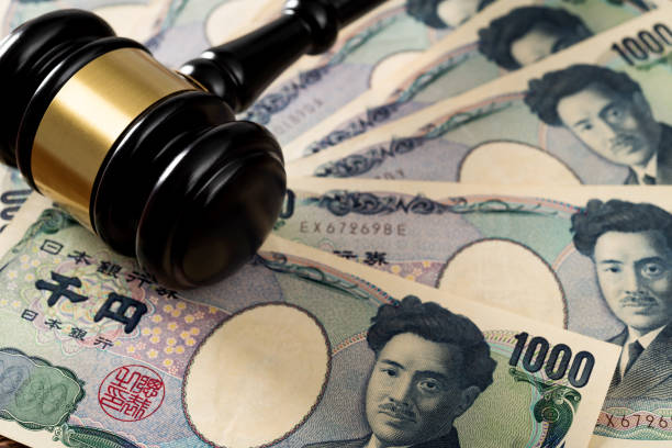 istock Gavel on stack of Japanese currency 1439947465
