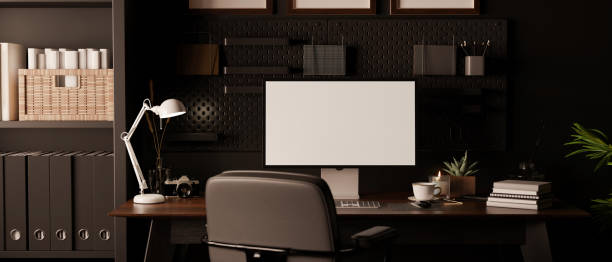 istock Modern dark loft homer workspace interior design with computer mockup on dark wood table 1439948031