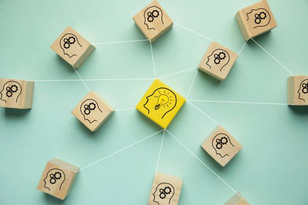 istock Wooden blocks with light bulb and gear icons 1439950019