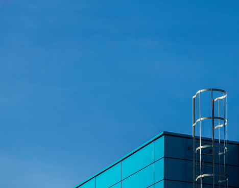 abstract shapes of modern building against a blue sky