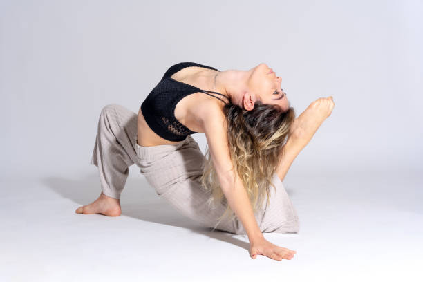 istock Young dancer in a studio photo session with a white background, ballerina, ballet, with a shadow 1439953789