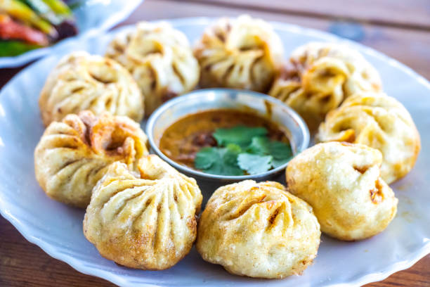 Nepali Style Fried Tibetan Momo Dumplings Nepali Style Fried Tibetan Momo Dumplings nepalese culture stock pictures, royalty-free photos & images