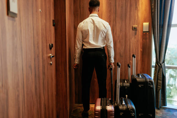istock Hotel attendant with luggage. 1439955141