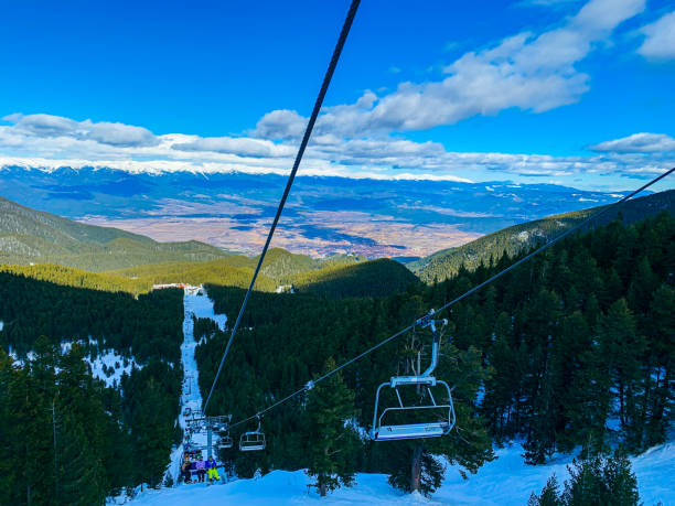 View from ski lift going up a mountain