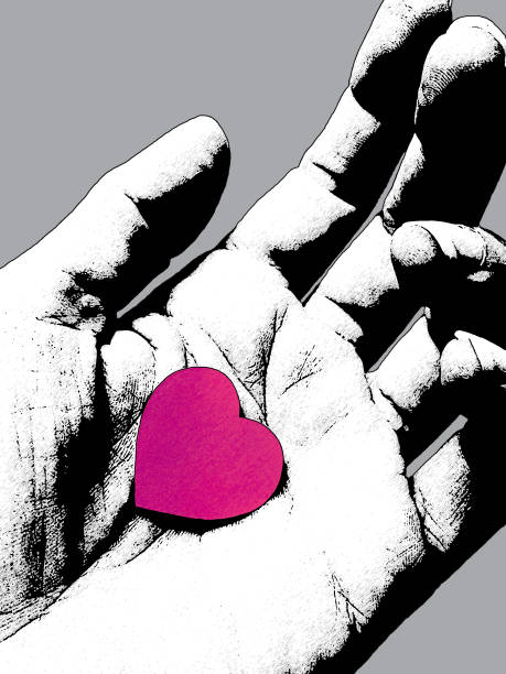 istock Black and white sketched hand holding a paper heart 1439956040