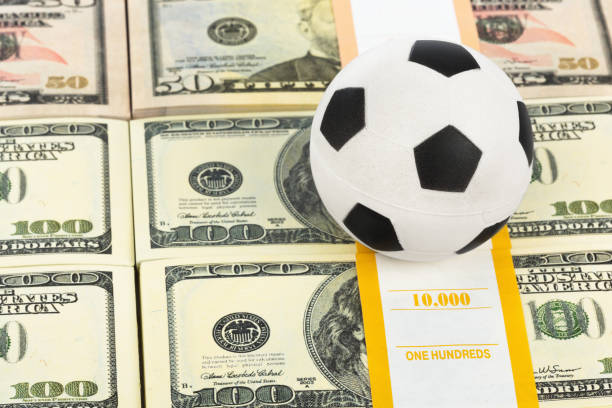 istock Money and soccer ball 1439957617