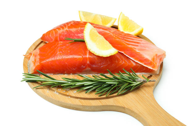 istock Board with fresh raw salmon isolated on white background 1439961163