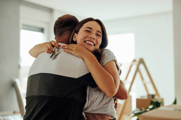 istock Cheerful couple buying new apartment. 1439962387