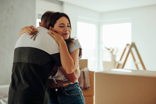 istock Cheerful couple with apartment keys. 1439962431