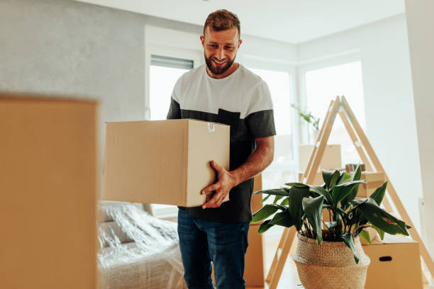 istock Caucasian man moving into apartment. 1439962552