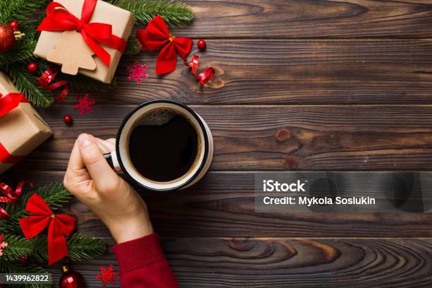 Woman Holding Cup Of Coffee Woman Hands Holding A Mug With Hot Coffee Winter And Christmas Time Concept Stock Photo - Download Image Now