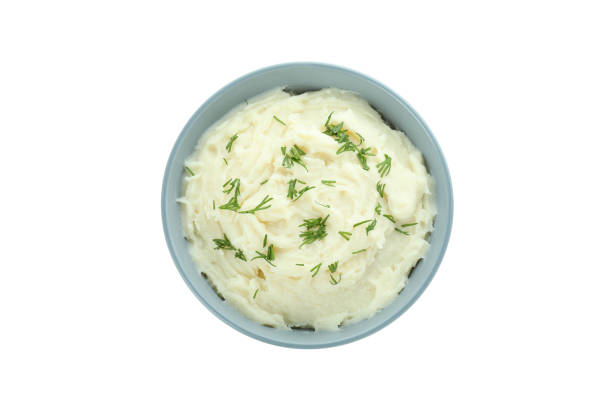 istock Bowl of mashed potatoes isolated on white background 1439968090