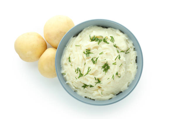 istock Bowl of mashed potatoes isolated on white background 1439969662