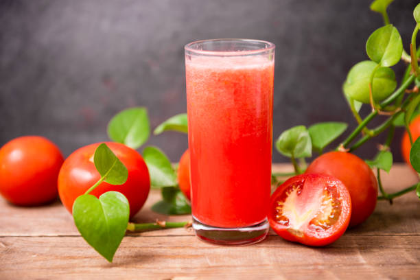 istock Fresh tomato juice on wooden table 1439969897