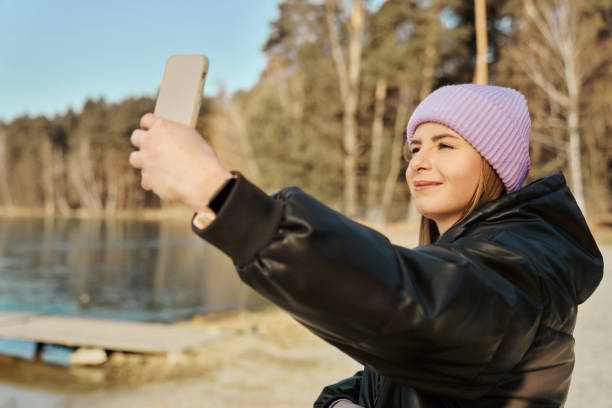 istock Caucasian woman making selfie  outdoors in the winter 1439969955