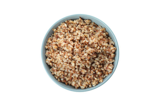 istock Tasty cooked buckwheat isolated on white background 1439970335