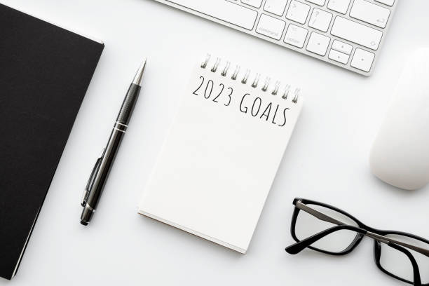 istock Notebook with 2023 goals text on it to apply new year resolutions and plan. 1439970364