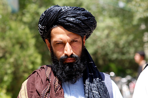 An Afghan Taliban from pashtun ethnicity. The photo was taken in an event where authorities of Education ministry have gathered in a public school in eastern Logar province on September 14,2022. In this event, and foreign aid organization donated food packages to beneficiaries. At the end the Taliban official demanded more assistance from international aid organizations.\nLogar, Afghanistan, September 14, 2022.
