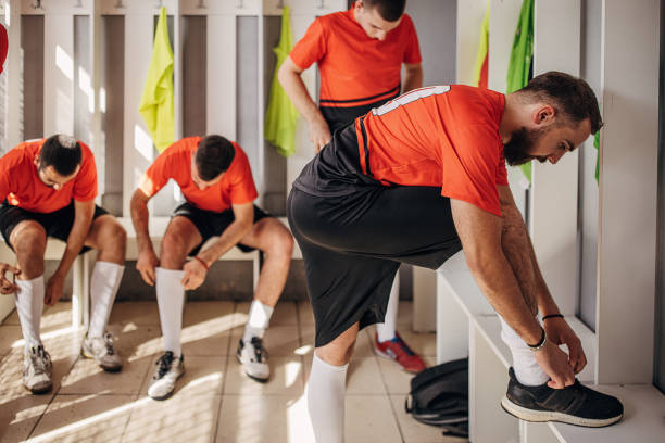 istock Soccer players in locker room 1439972388