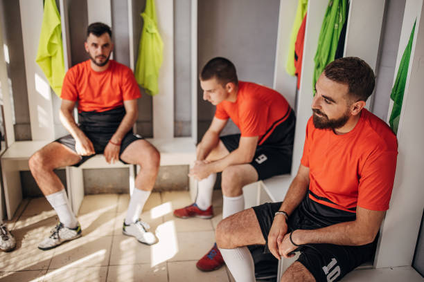 istock Soccer players in locker room 1439972959