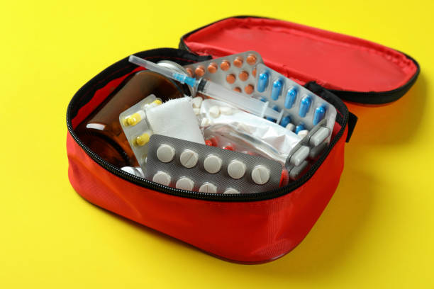 istock First aid medical kit on yellow background 1439974127