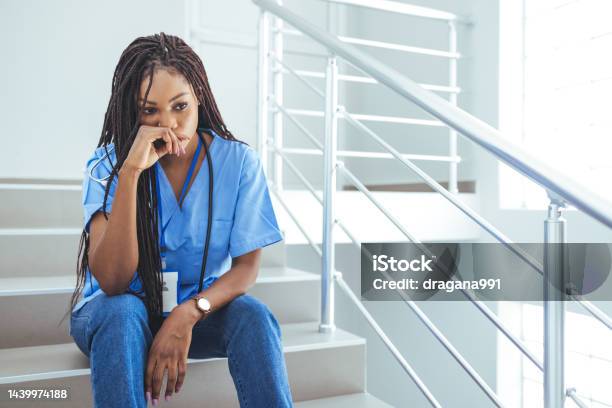 Close Up Of Upset Female Nurse Stock Photo - Download Image Now - Nurse, Emotional Stress, Sadness
