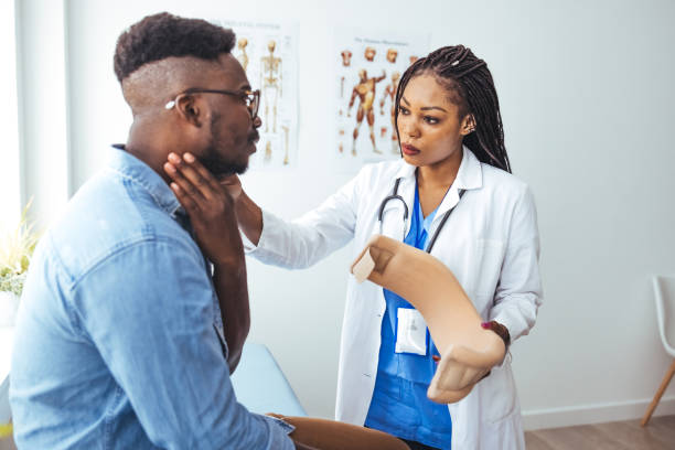istock Man with cervical neck collar at doctor office, asking for help and being in pain. 1439974227
