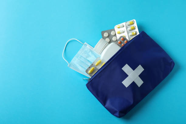 istock First aid medical kit on blue background 1439975066
