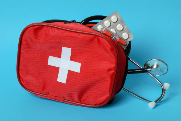 istock First aid medical kit on blue background 1439975736