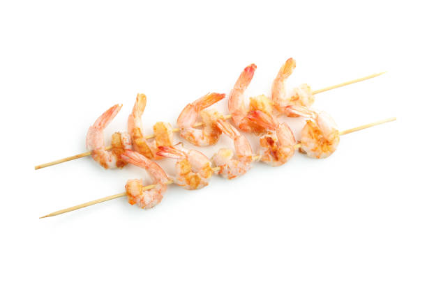 istock Tasty grilled shrimps isolated on white background 1439976852