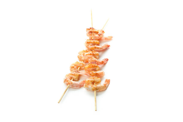 istock Tasty grilled shrimps isolated on white background 1439977228