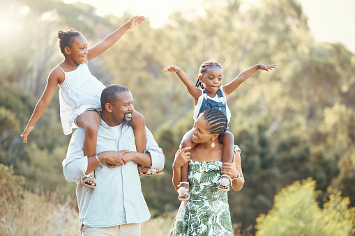 Family nature walking park, children and parents happy on walk in garden, communication with smile in summer and comic kids support from mother and father. African man and woman together with girls