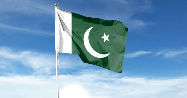istock Pakistan flag on cloudy sky. waving in the sky 1439980587