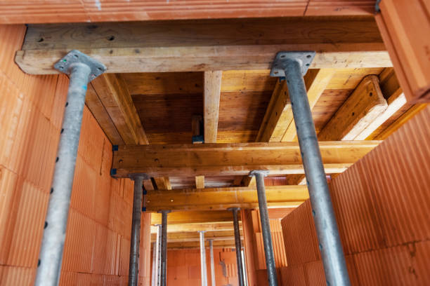 istock The supports of monolithic floor formwork at a construction site. Telescopic props for concrete flooring. 1439981002