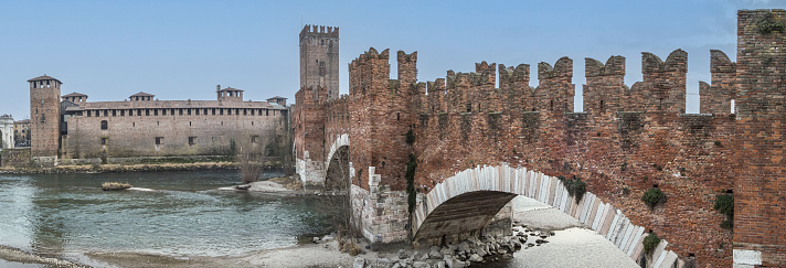 Verona, Italy - 03-04-2022: Extra wide angle view of The beautiful Castelvecchio and the bridge over the Adige in Verona