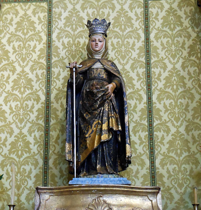 Virgin Mary statue figure on a pedestal inside a church