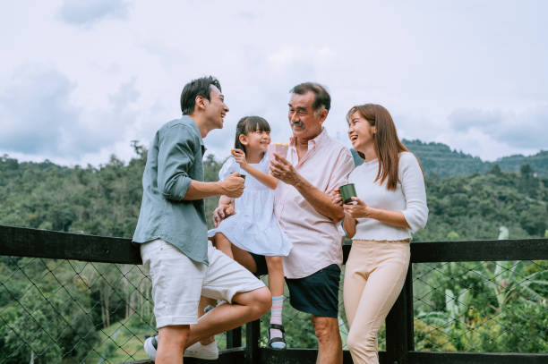 Asian Chinese family having great time at the resort hotel Family, Tourist Resort, Forest, Happiness asian ethnicity family stock pictures, royalty-free photos & images