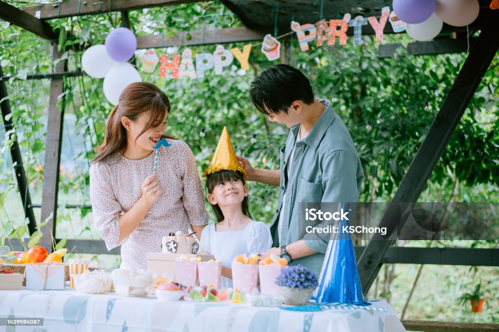 Asian Chinese family celebrate daughter birthday Party - Social Event, Birthday, Family, Celebration, Senior Adult Birthday Stock Photo