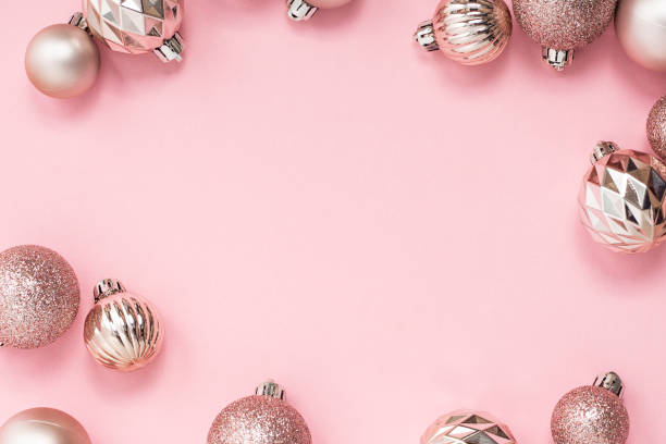 istock Decorative pink Christmas balls on a pink background. Top view, flat lay. 1439984117