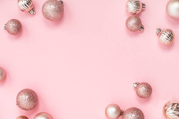 istock Decorative Christmas balls, empty space for text on a pink background. Top view, flat lay. 1439984662