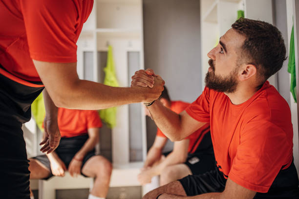 istock Soccer players in locker room 1439985028