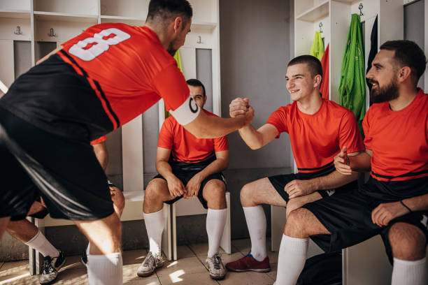istock Soccer players in locker room 1439985655