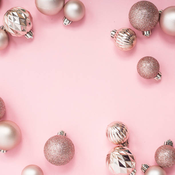istock Decorative Christmas balls, empty space for text on a pink background. Top view, flat lay. 1439985753