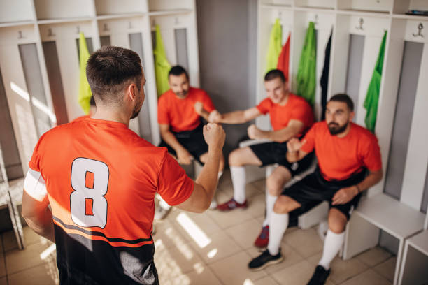 istock Soccer players in locker room 1439985755