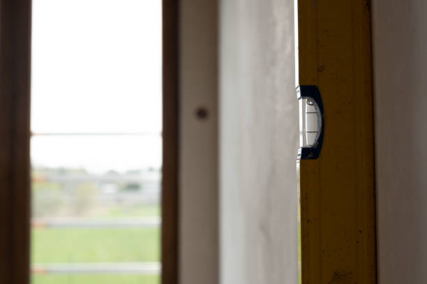 istock Spirit level next to wall in new building 1439986549