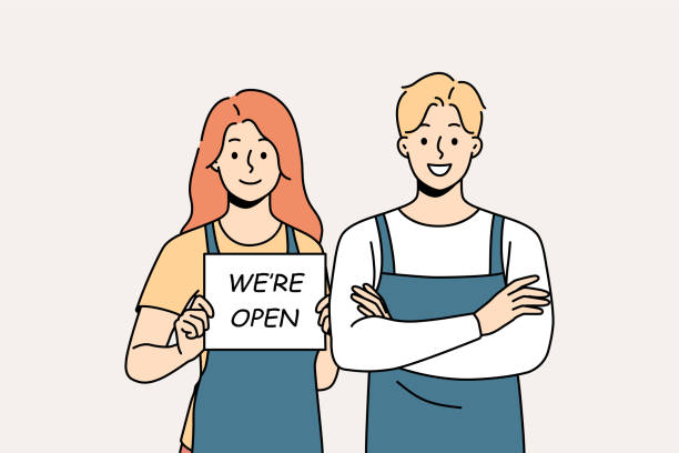 Smiling cafe staff notify about opening Smiling waiters in aprons hold open sign. Happy man and woman cafe staff notify about shop opening. Vector illustration. restaurant labor union stock illustrations